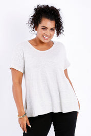 Model Sasha-Lee wearing size 16 of The Short Sleeve Swing Tee in colour Oatmeal, from the front, cropped image
