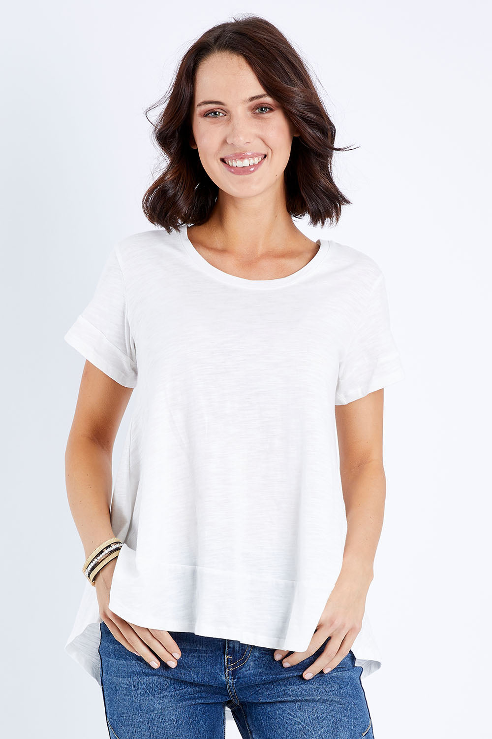 Model Andrea wearing size 10 of The Short Sleeve Swing Tee in colour White (White), from the front, cropped image