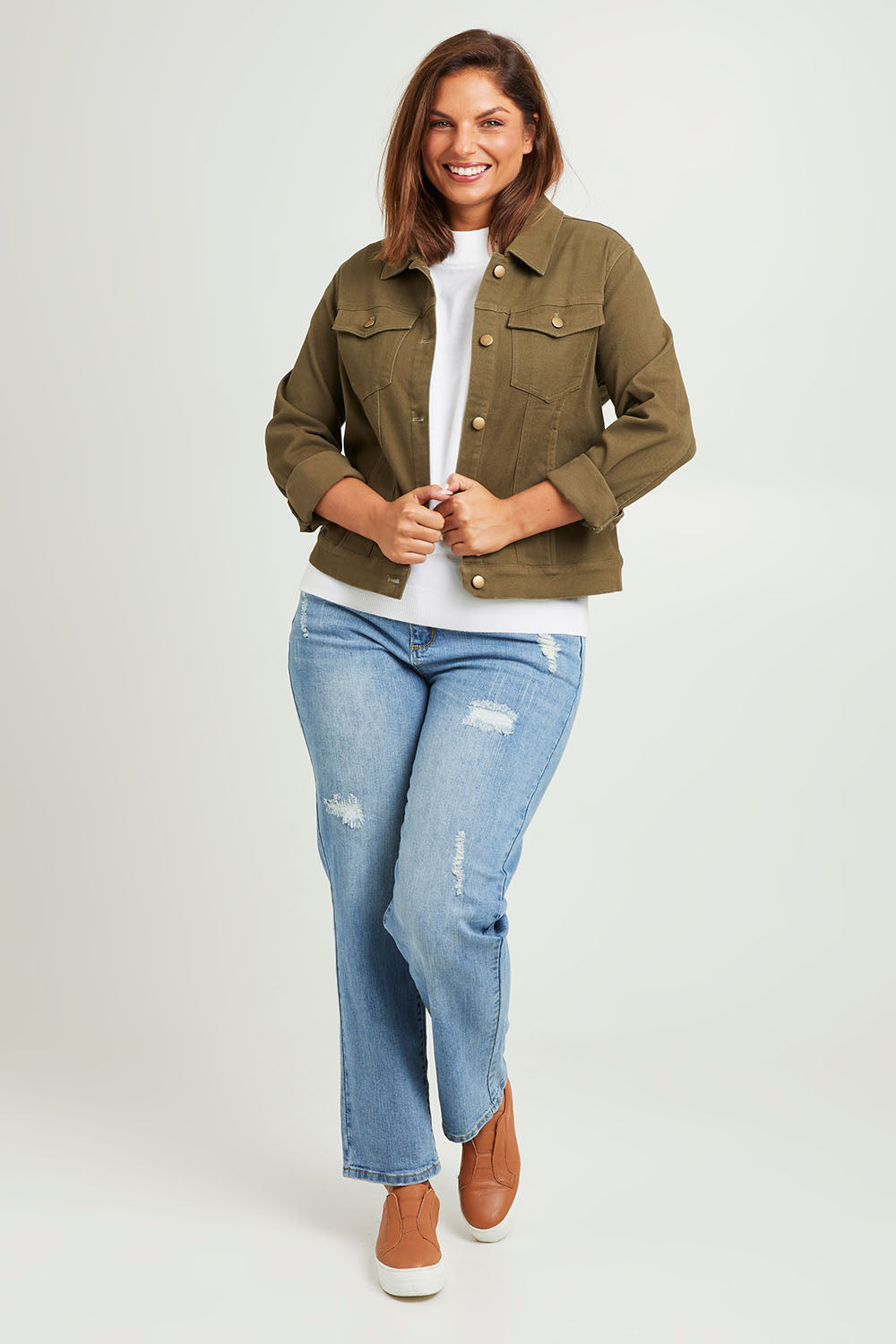 Model Monique wearing size 14 of The Denim Jacket in colour Armygreen (Green), from the front, showing the whole outfit