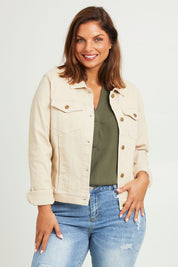 Model Monique wearing size 14 of The Denim Jacket in colour Echru, from the front, cropped image