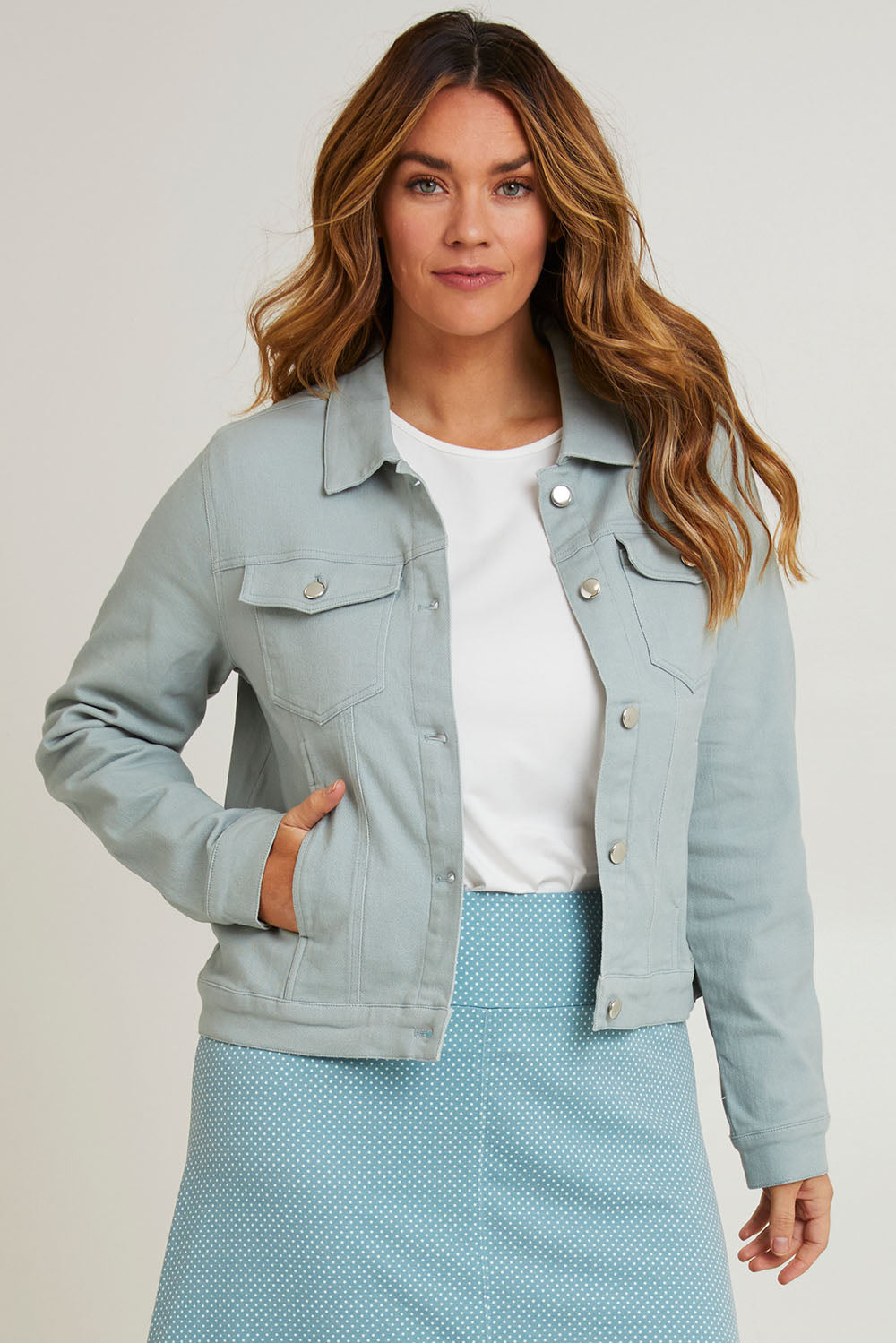 Model Laura wearing size 14 of The Denim Jacket in colour Seafoam (Green), from the front, cropped image