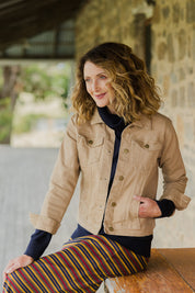 Model Emma wearing size 10 of The Denim Jacket in colour Tan, from the front, cropped image