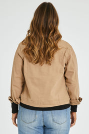 Model Laura wearing size 14 of The Denim Jacket in colour Tan, from the back