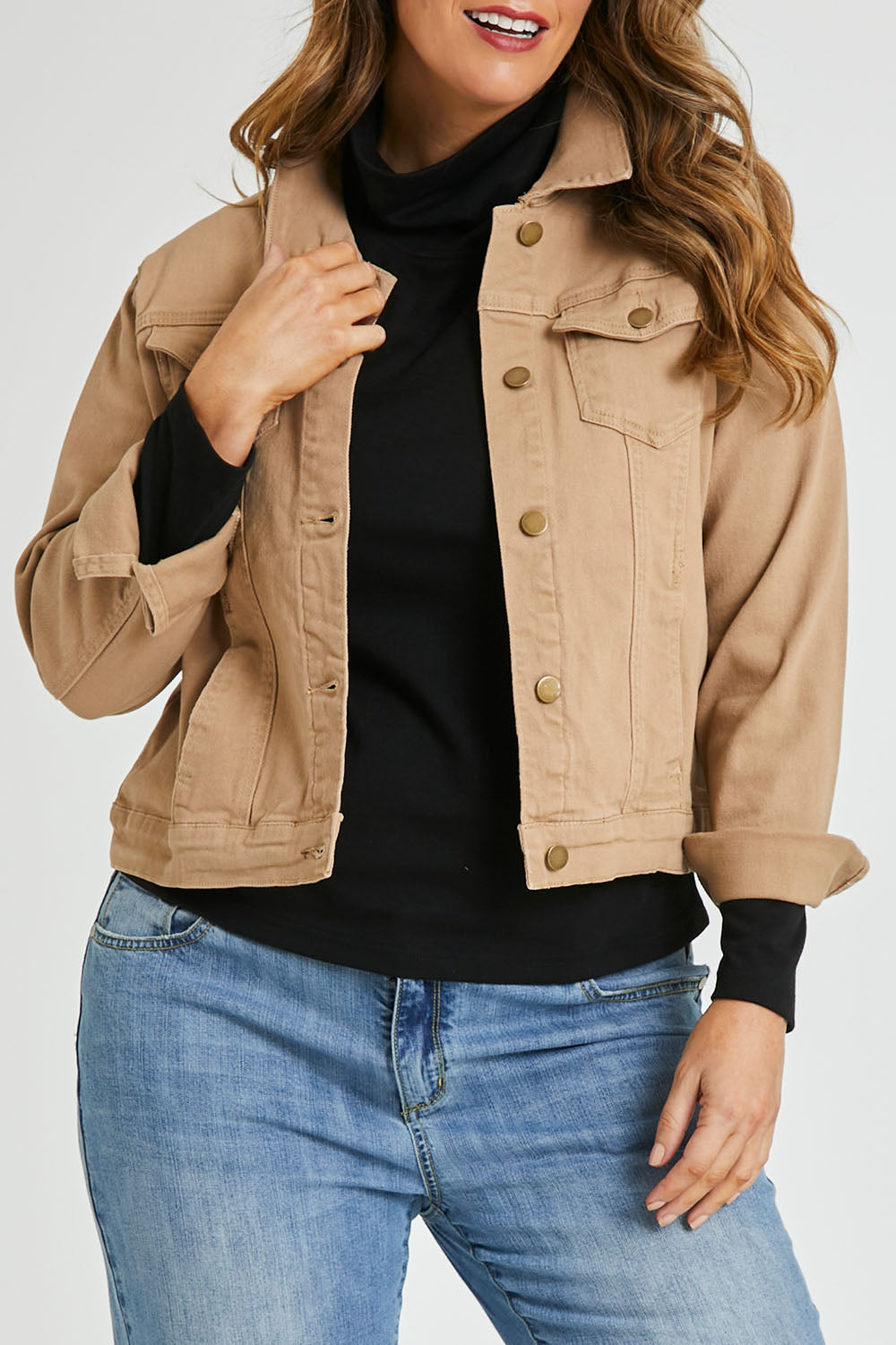 Model Laura wearing size 14 of The Denim Jacket in colour Tan, from the front, cropped image