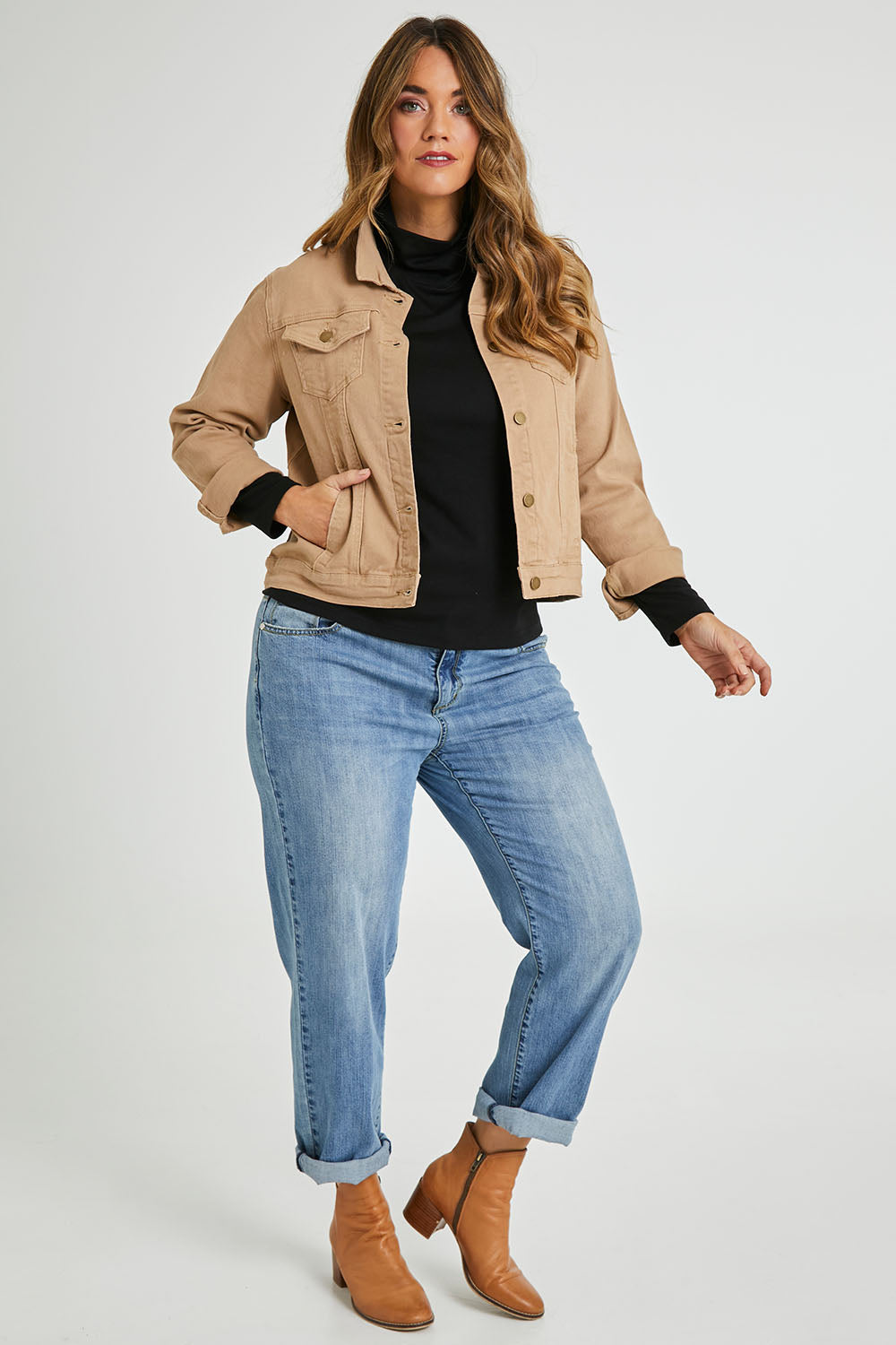 Model Laura wearing size 14 of The Denim Jacket in colour Tan, from the front, showing the whole outfit