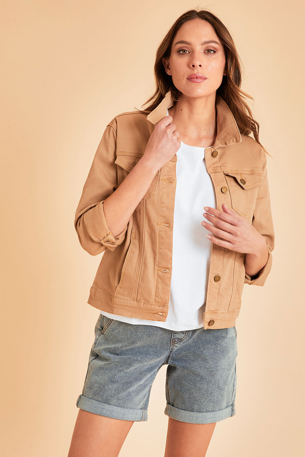 Model Madeline wearing size 10 of The Denim Jacket in colour Tan, from the front, showing the whole outfit