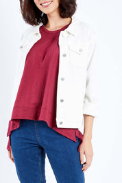 Model Andrea wearing size 10 of The Denim Jacket in colour Whitedenim (White), from the front, cropped image
