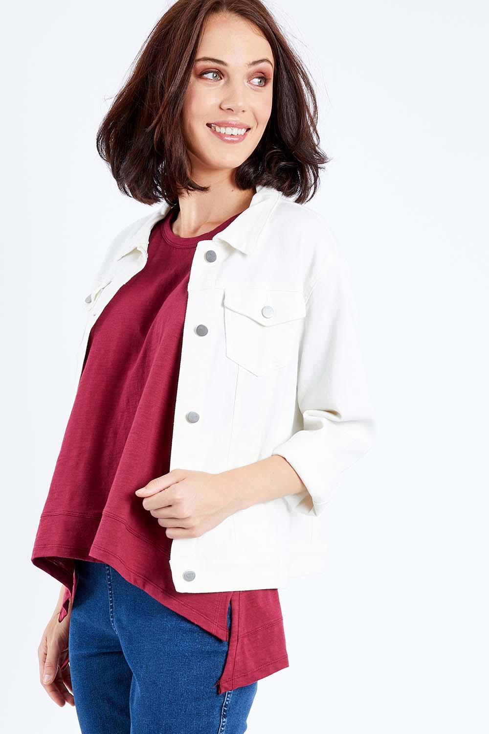 Model Andrea wearing size 10 of The Denim Jacket in colour Whitedenim (White), from the front, cropped image
