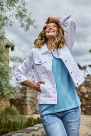 Model Emma wearing size 10 of The Denim Jacket in colour Whitedenim (White), from the front, showing the whole outfit