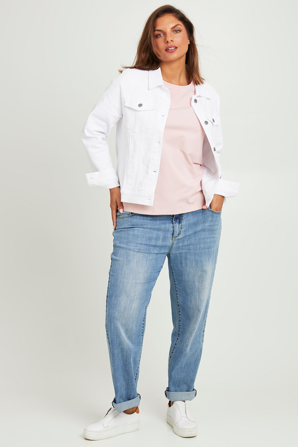 Model Monique wearing size 14 of The Denim Jacket in colour Whitedenim (White), from the front, showing the whole outfit