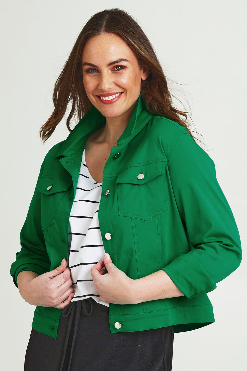 Model Jane wearing size 14 of The Tencel Blend Denim Jacket in colour Emerald (Green), from the front, cropped image