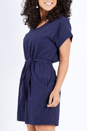 Model Pamela wearing size 10 of The Upcycled Cotton Playsuit in colour Navy (Blue), from the front, cropped image