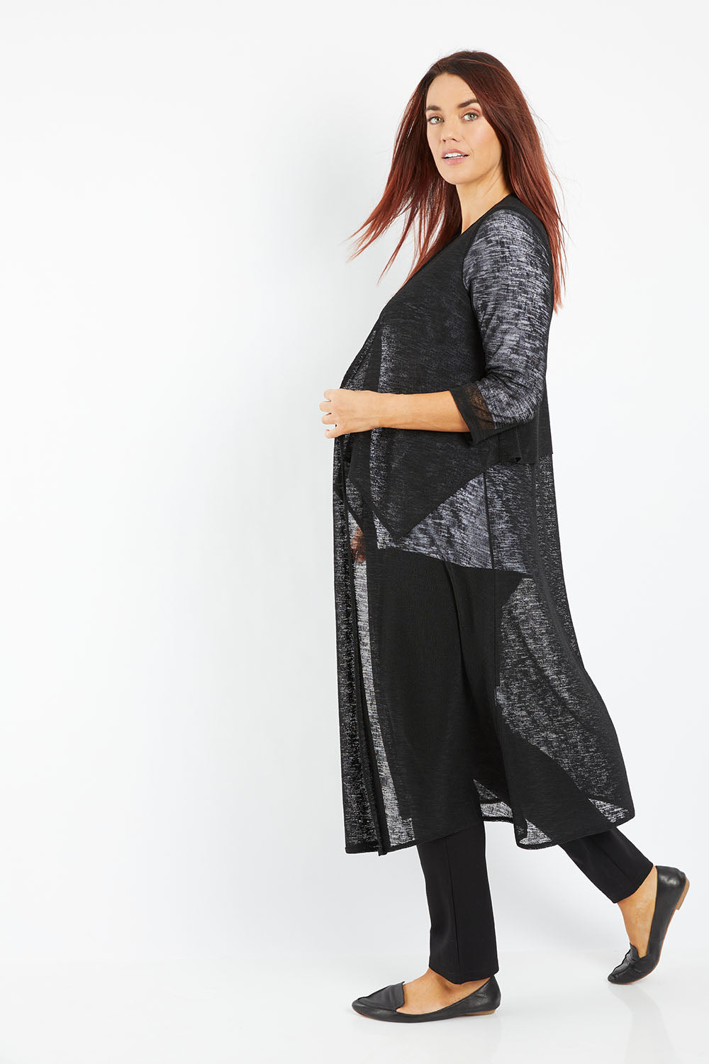 Model Laura wearing size 14 of The Throw Over Duster Cardi in colour Black (Black), from the front, showing the whole outfit