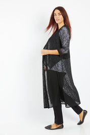 Model Laura wearing size 14 of The Throw Over Duster Cardi in colour Black (Black), from the front, showing the whole outfit