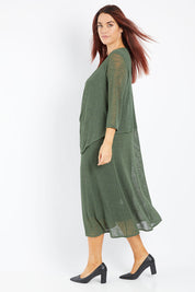 Model Laura wearing size 14 of The Throw Over Duster Cardi in colour Khaki (Green), from the front, showing the whole outfit