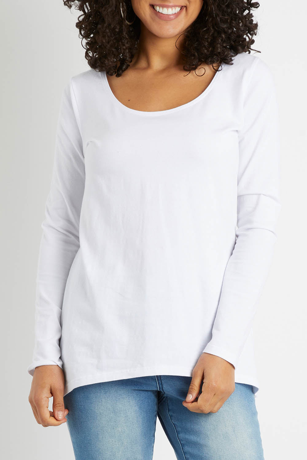 Model Pamela wearing size 10 of The Scoop Neck Essential Tee in colour White (White), from the front, cropped image