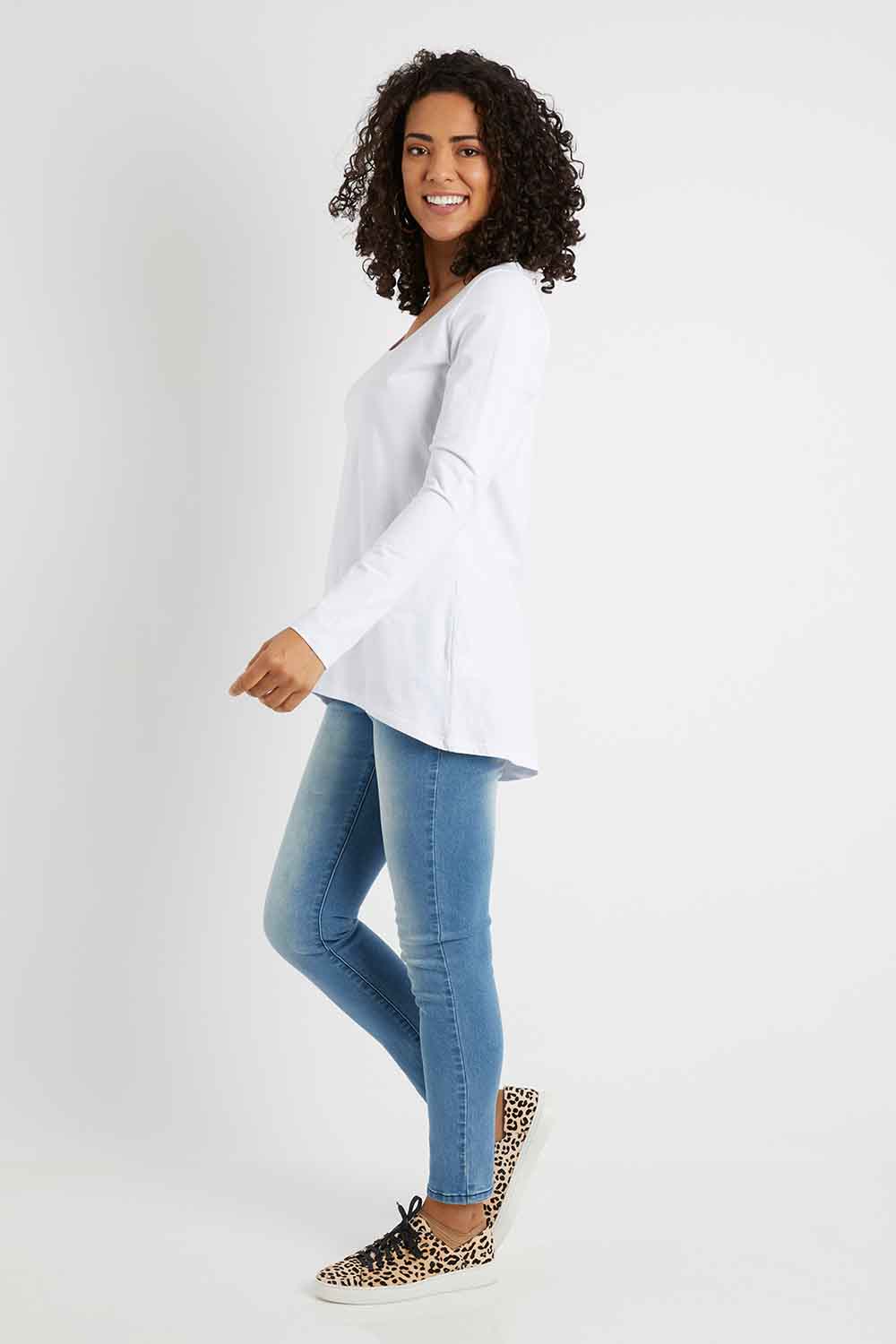 Model Pamela wearing size 10 of The Scoop Neck Essential Tee in colour White (White), from the front, showing the whole outfit