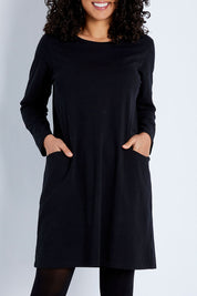 Model Pamela wearing size 10 of The Essential Tunic Top in colour Black (Black), from the front, cropped image