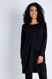 Model Pamela wearing size 10 of The Essential Tunic Top in colour Black (Black), from the front, cropped image