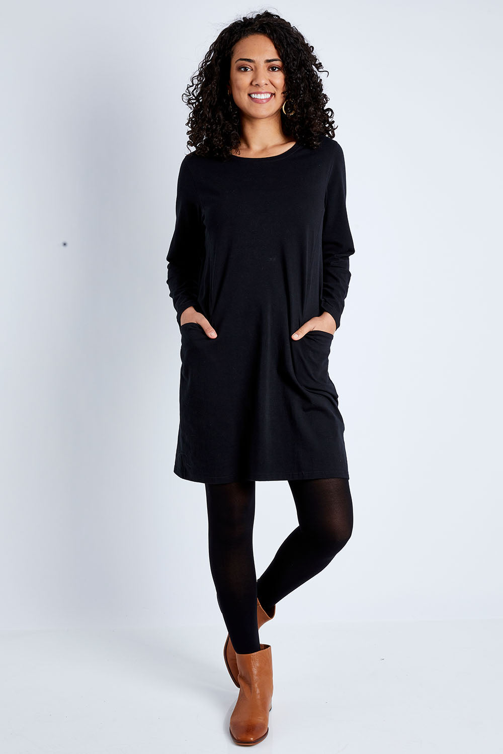 Model Pamela wearing size 10 of The Essential Tunic Top in colour Black (Black), from the front, showing the whole outfit