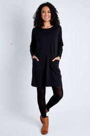 Model Pamela wearing size 10 of The Essential Tunic Top in colour Black (Black), from the front, showing the whole outfit
