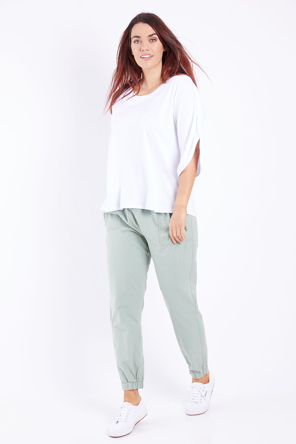 Model Laura wearing size 14 of The Split Sleeve Tee in colour White (White), from the front, showing the whole outfit