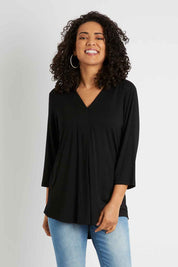 Model Pamela wearing size 10 of The Stitch Detail Top in colour Black (Black), from the front, cropped image