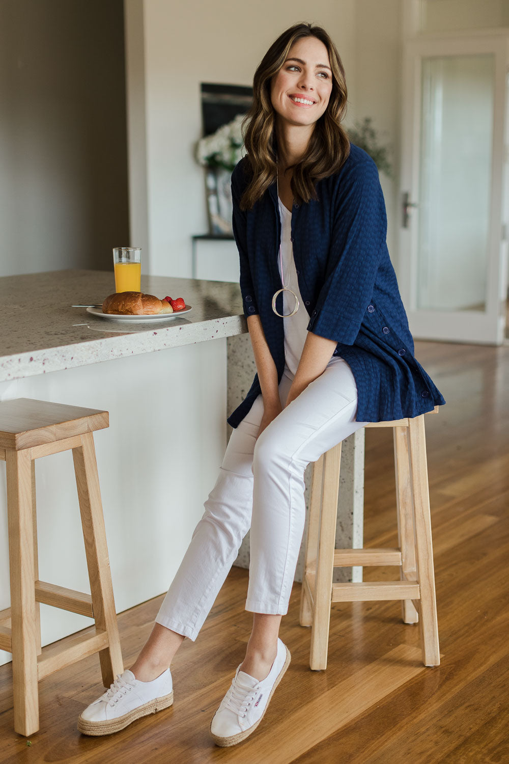 Model Madeline wearing size 10 of The Textured Overshirt in colour Navy (Blue), from the front, showing the whole outfit