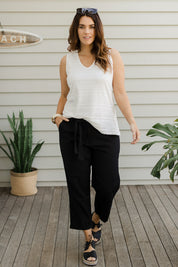 Model Laura wearing size 14 of The Sash Detail Pant in colour Black (Black), from the front, showing the whole outfit