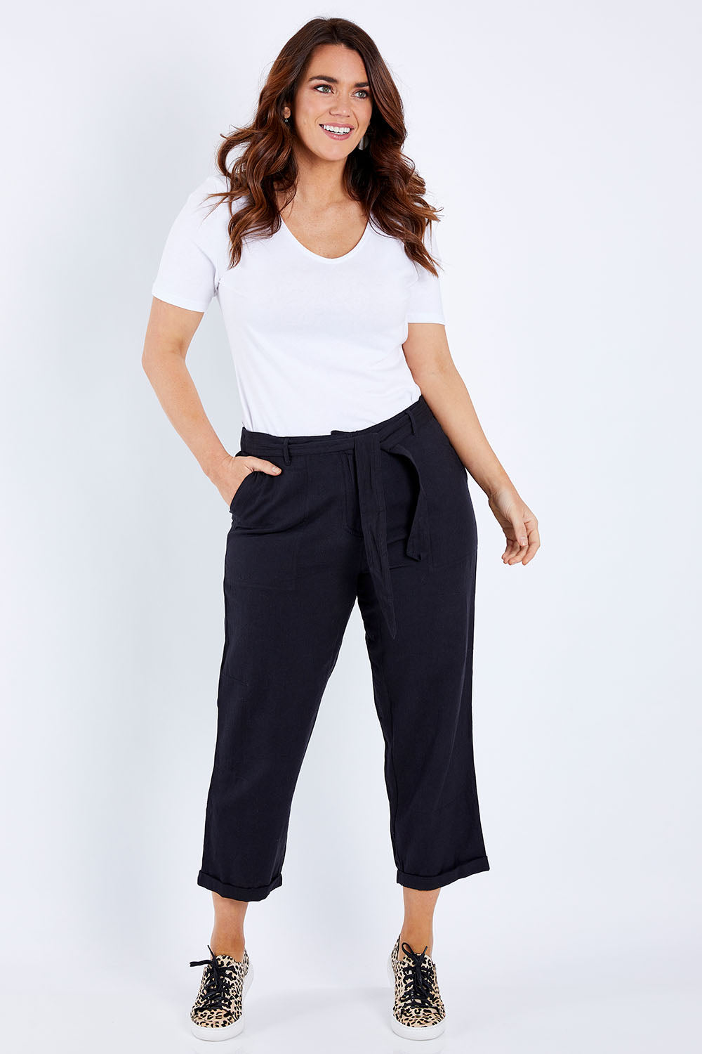 Model Laura wearing size 14 of The Sash Detail Pant in colour Black (Black), from the front, showing the whole outfit