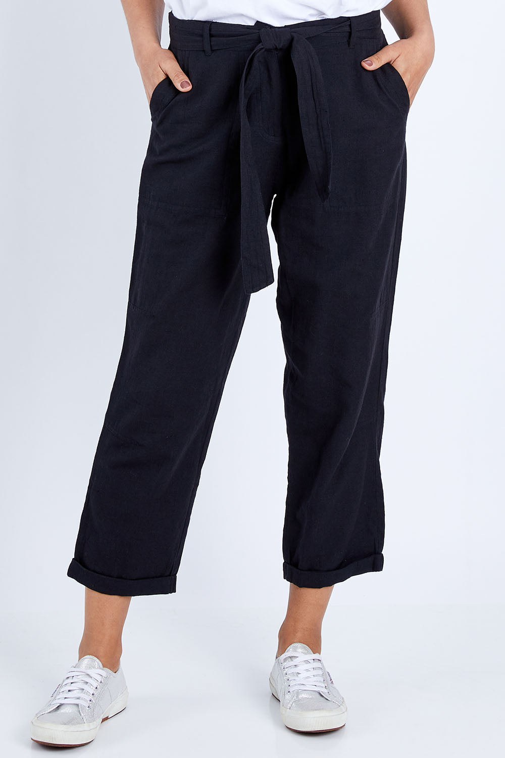 Model Pamela wearing size 10 of The Sash Detail Pant in colour Black (Black), from the front, cropped image
