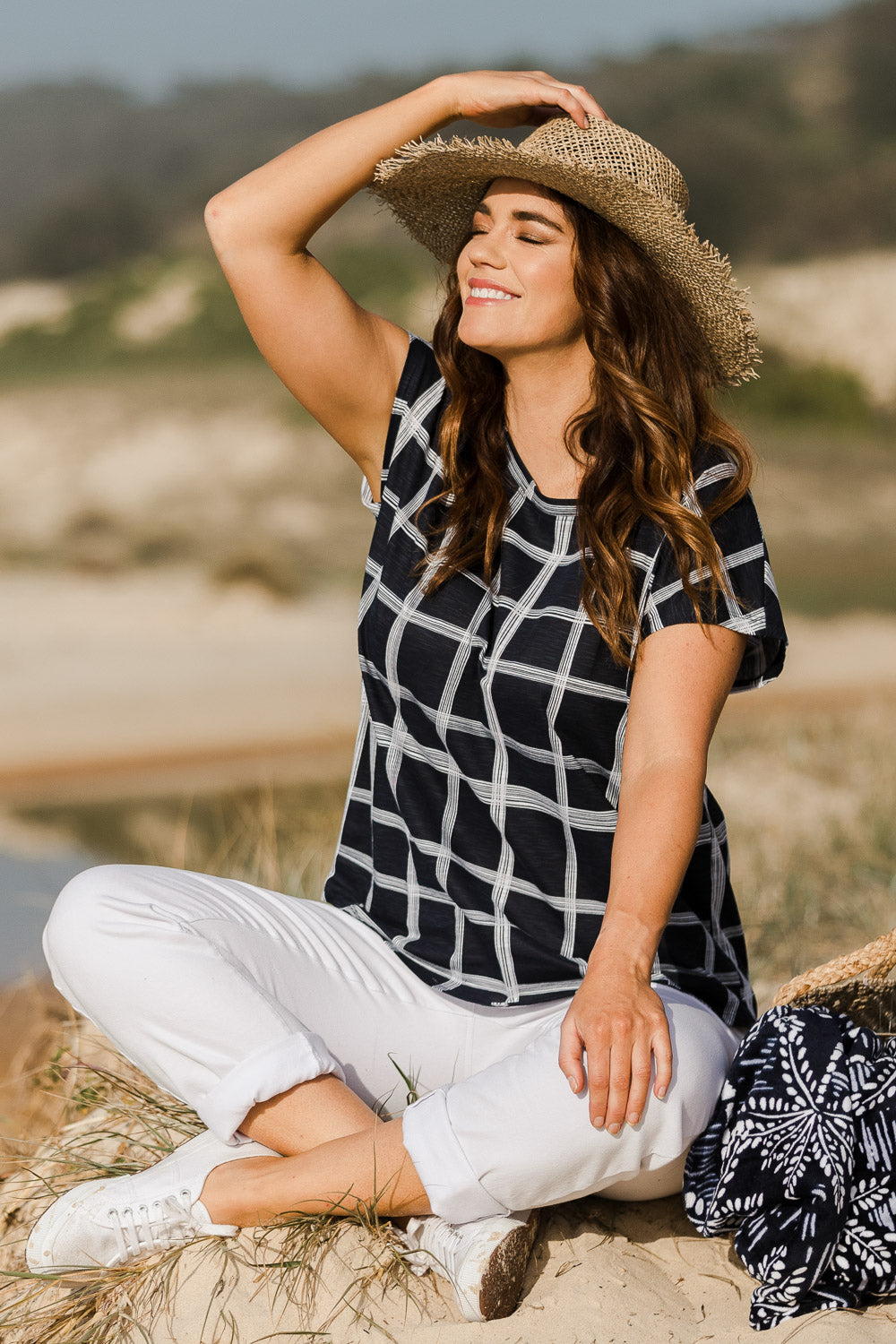Model Laura wearing size 14 of The Check Scoop Neck Tee in colour Navy (Blue), from the front, showing the whole outfit
