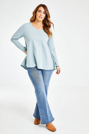 Model Laura wearing size 14 of The Long Sleeve Swing Tee in colour Chambray (Blue), from the front, showing the whole outfit