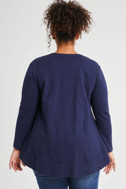 Model Alexis wearing size 16 of The Long Sleeve Swing Tee in colour Navy (Blue), from the back