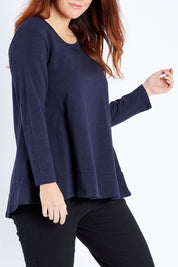 Model Laura wearing size 12 of The Long Sleeve Swing Tee in colour Navy (Blue), from the front, cropped image