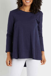 Model Pamela wearing size 10 of The Long Sleeve Swing Tee in colour Navy (Blue), from the front, cropped image