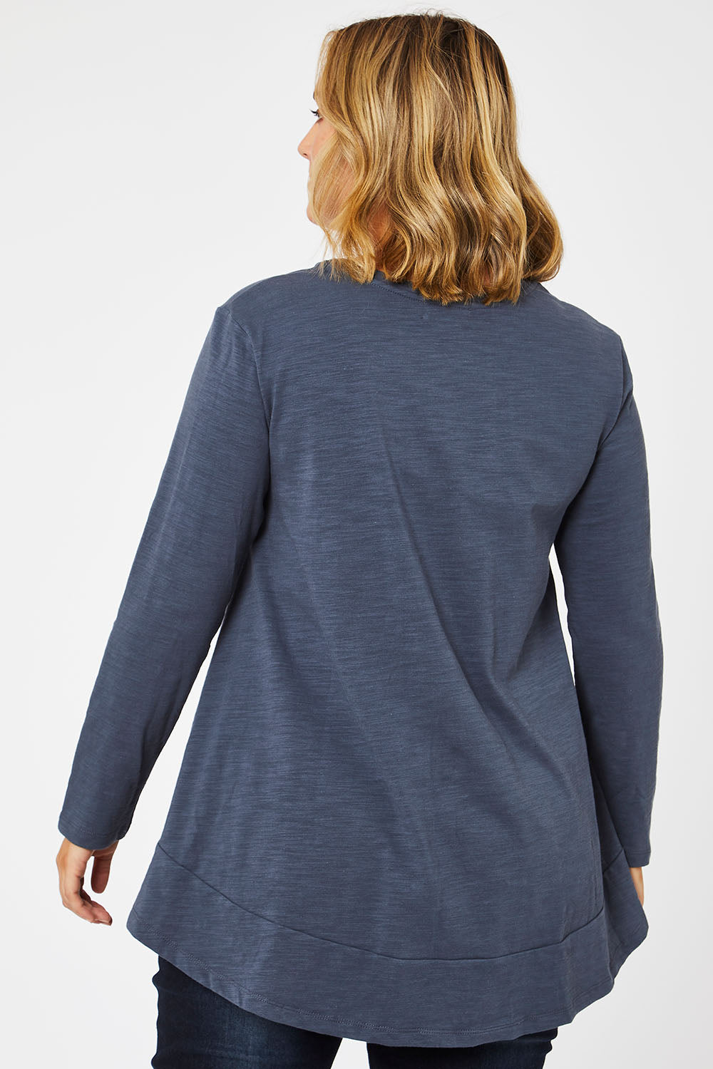Model Jess wearing size 14 of The Long Sleeve Swing Tee in colour Slate (Grey), from the back