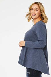Model Jess wearing size 14 of The Long Sleeve Swing Tee in colour Slate (Grey), from the front, cropped image