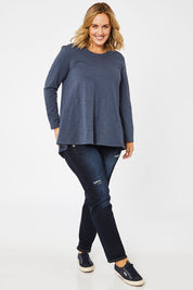 Model Jess wearing size 14 of The Long Sleeve Swing Tee in colour Slate (Grey), from the front, showing the whole outfit