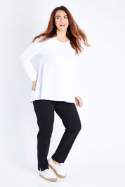 Model Laura wearing size 12 of The Long Sleeve Swing Tee in colour White (White), from the front, showing the whole outfit