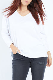 Model Laura wearing size 14 of The V Neck Split Back Top in colour White (White), from the front, cropped image