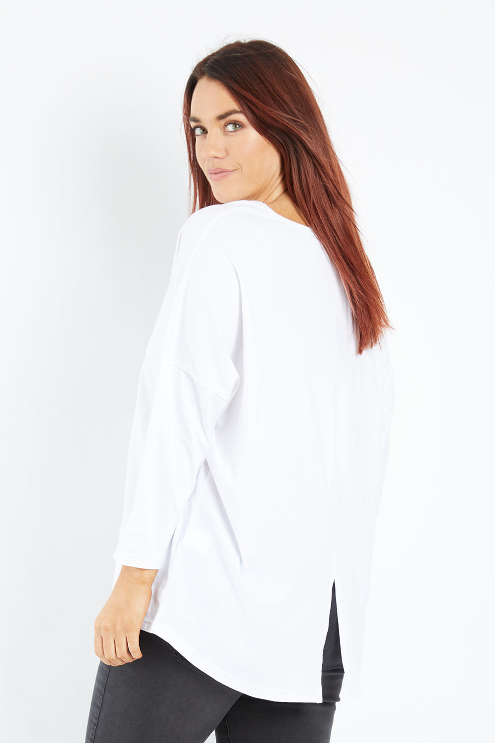 Model Laura wearing size 14 of The V Neck Split Back Top in colour White (White), from the front, cropped image