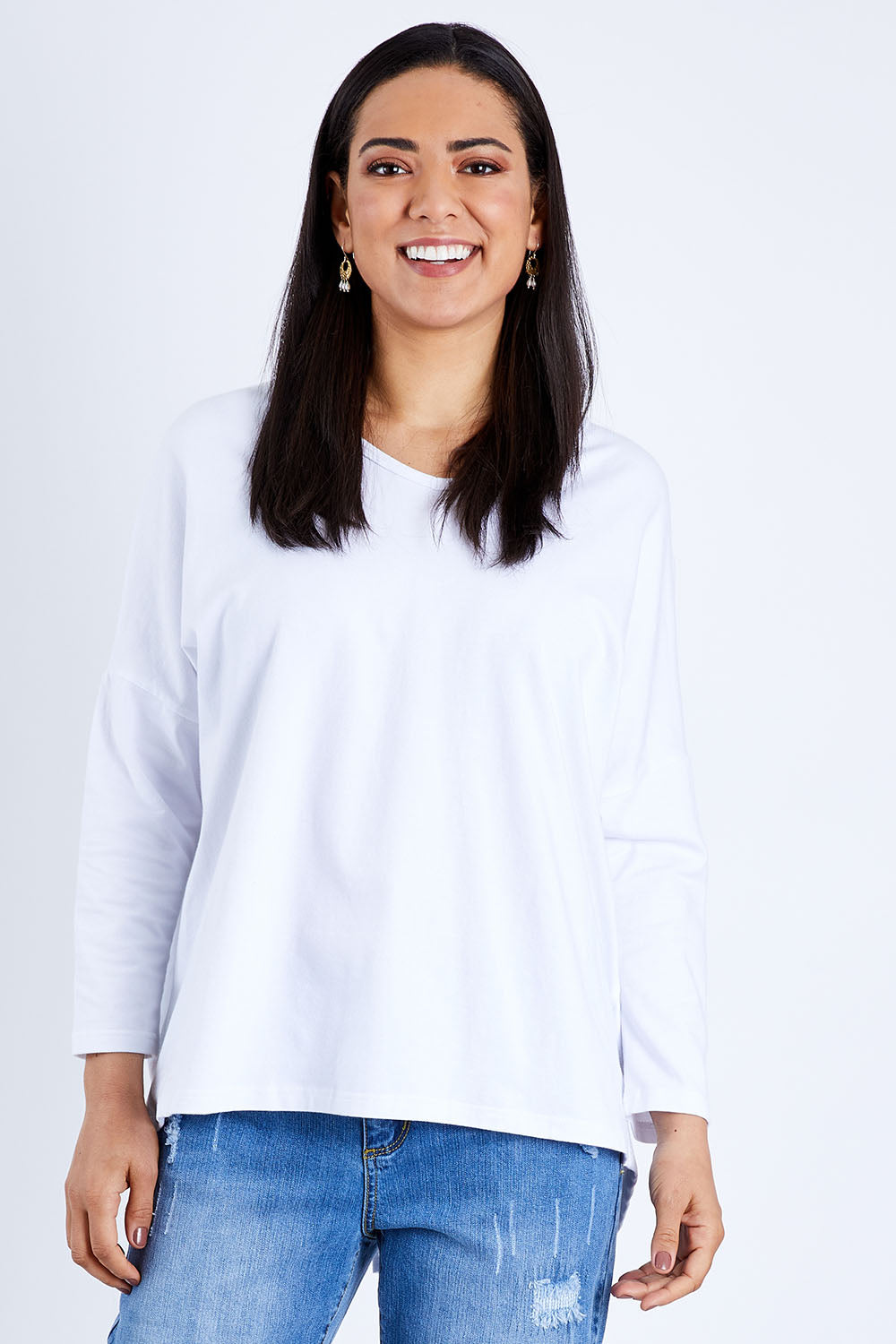 Model Pamela wearing size 10 of The V Neck Split Back Top in colour White (White), from the front, cropped image