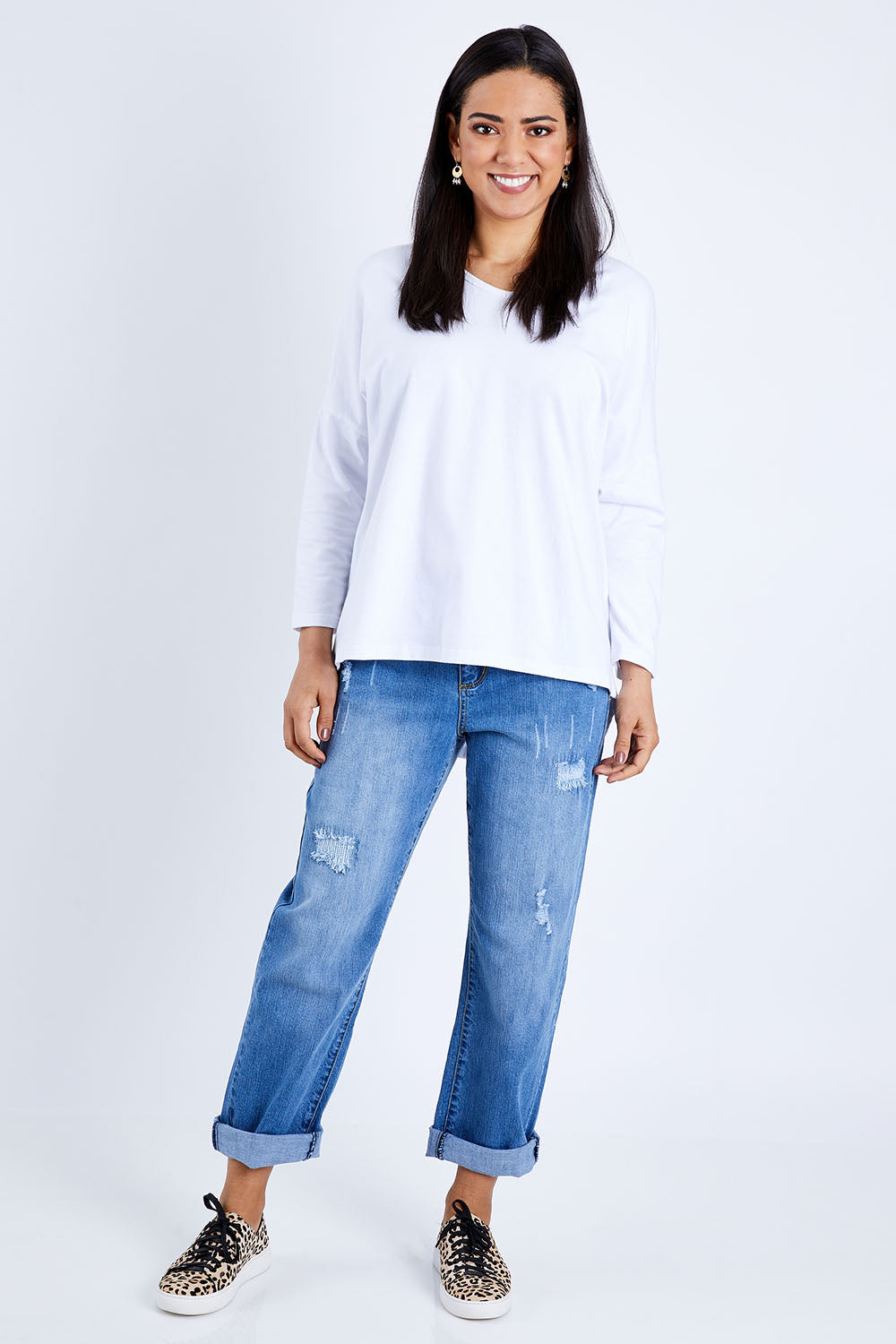 Model Pamela wearing size 10 of The V Neck Split Back Top in colour White (White), from the front, showing the whole outfit