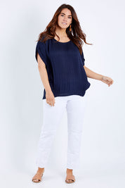 Model Laura wearing size 14 of The Textured Shell Top in colour Navy (Blue), from the front, showing the whole outfit