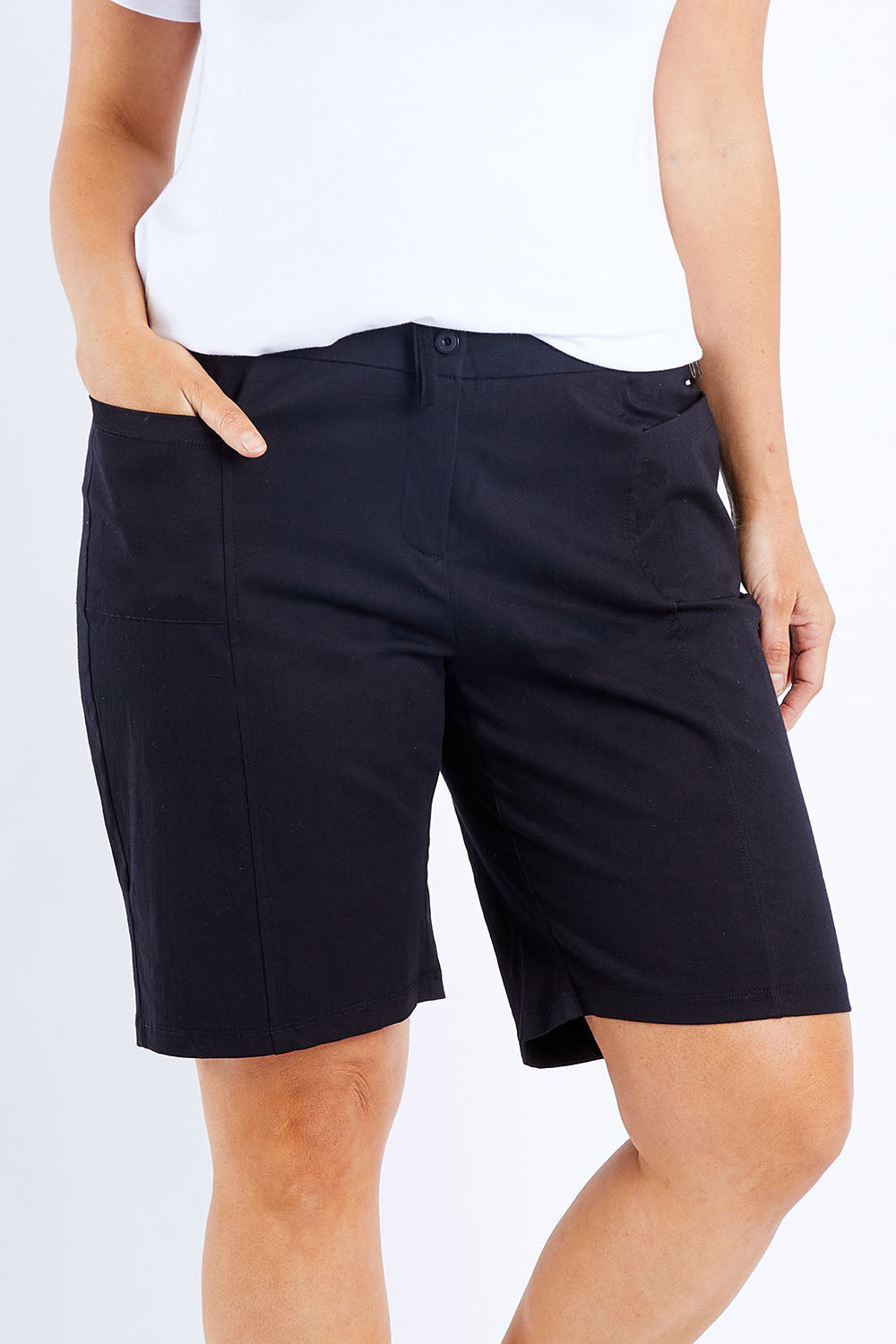 Model Laura wearing size 14 of The Cotton Blend Walk Short in colour Black (Black), from the front, cropped image