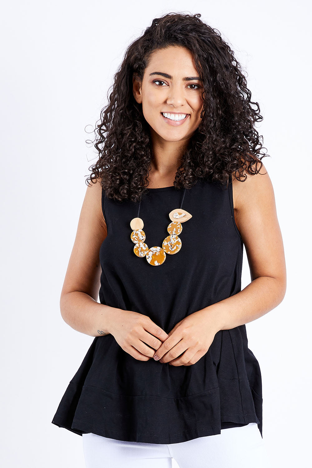 Model Pamela wearing size 10 of The Swing Tank in colour Black (Black), from the front, cropped image