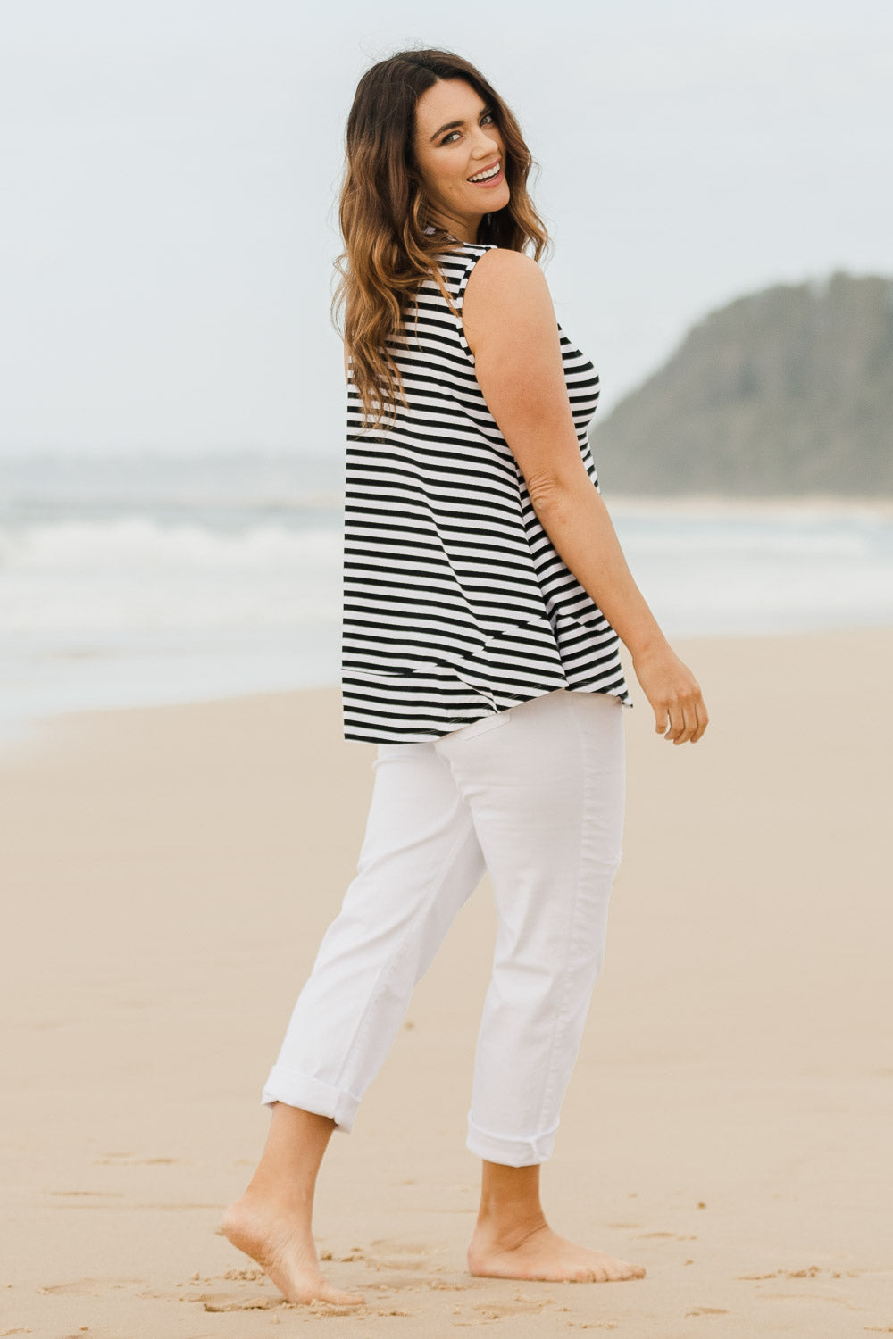 Model Laura wearing size 14 of The Swing Tank in colour Blkstripe (Black), from the front, showing the whole outfit