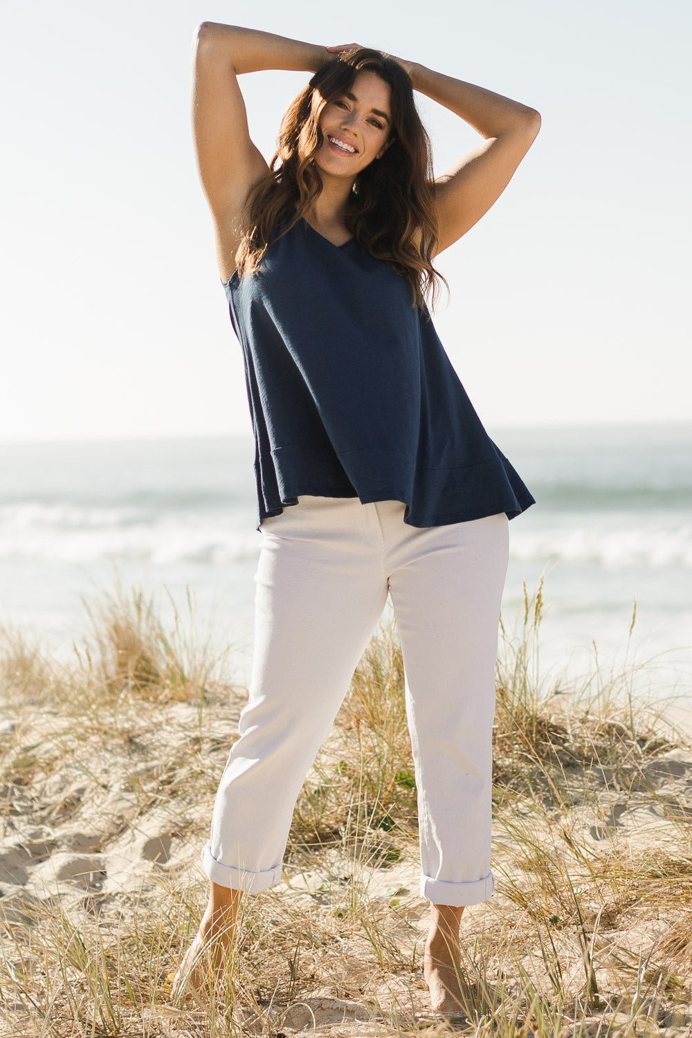 Model Laura wearing size 14 of The Swing Tank in colour Navy (Blue), from the front, showing the whole outfit