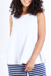 Model Pamela wearing size 10 of The Swing Tank in colour White (White), from the front, cropped image